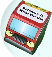 Cardboard truck with Behavior is What We Do written on the roof